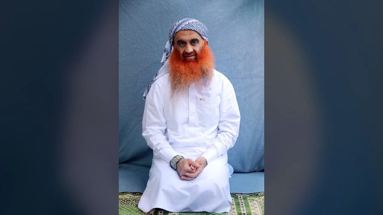 Khalid Sheikh Mohammed seated for a 2022 Department of Defense portrait.